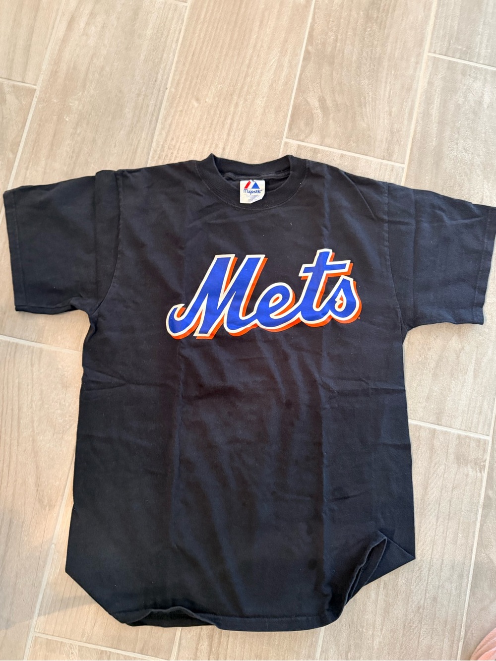 Majestic Black Tee with Red and Blue Logo Tag